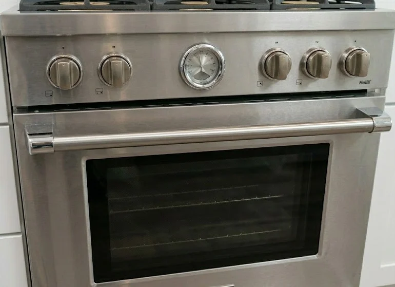 0bc6219e-2134-4c51-a942-56634f5da68c Pro Appliance Repair range repair services for a stainless steel gas oven in San Antonio.